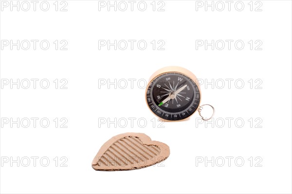 Heart shape paper and compass on a white background