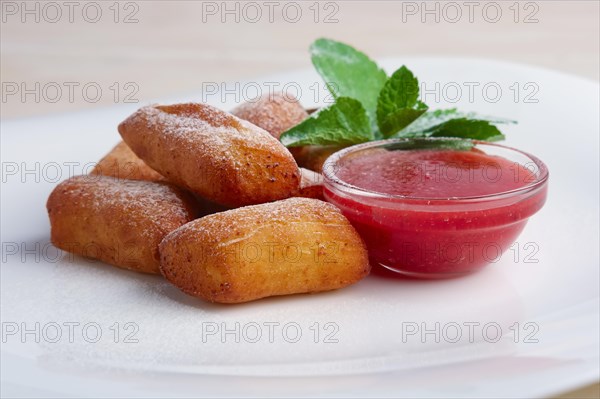 Curd bars with strawberry jam decorated with mint leaf