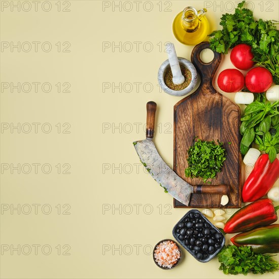 Top view of mezzaluna and ffresh vegetables. World vegan food day concept