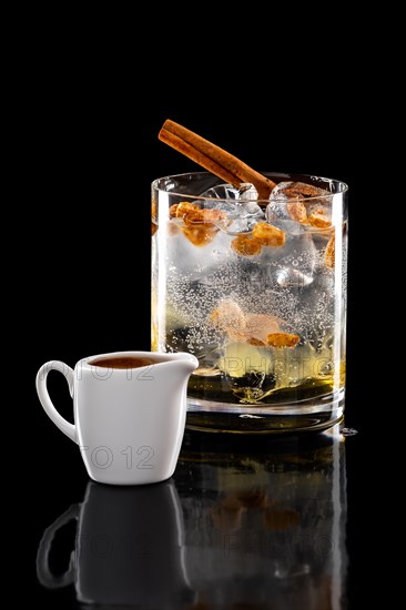 Espresso tonic refreshing drink isolated on black background