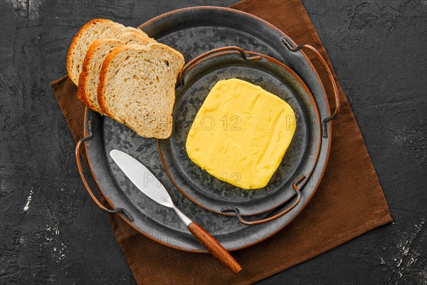 Homemade rustic butter and a spreading knife