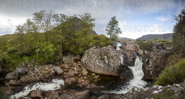 Waterfalls in front of mountain range Buachaille Etive Mor