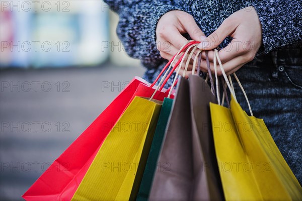 Close up hands shopper with bags