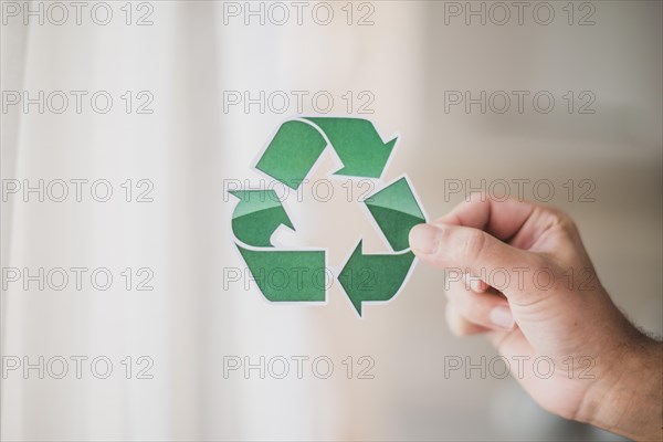Man s hand showing recycle icon