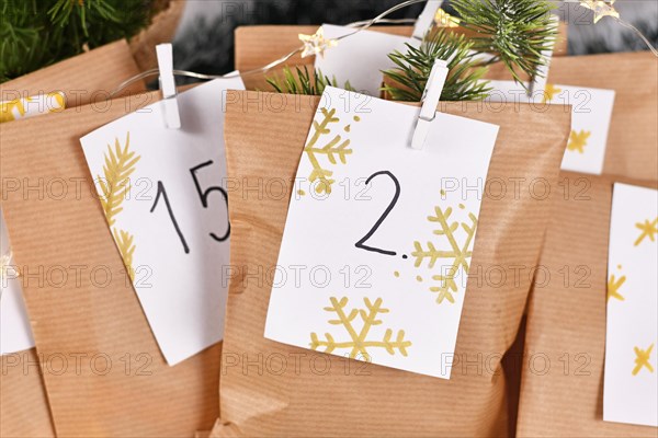 Homemade Advent calendar made from craft paper bags with handwritten numbers