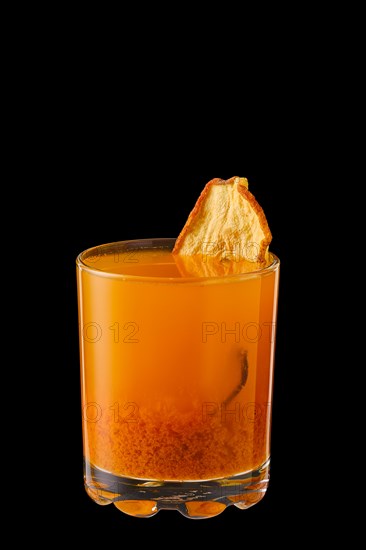 Hot sea buckthorn and pear winter drink isolated on black