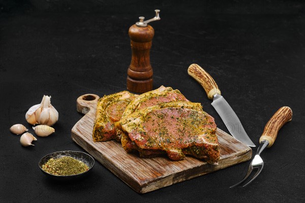 Marinated pork bone steak with spice ready for barbecue