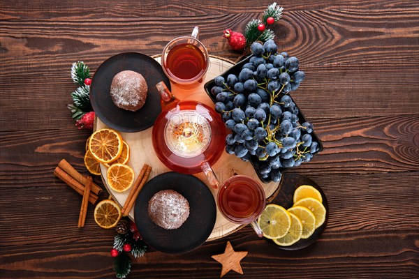 Top view of grape and lemon tea with chocolate cake