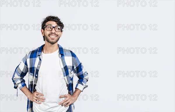 Thoughtful smiling person looking at a blank space. Smiling handsome man looking at an advertisement to the side. smiling man thinking and seeing a blank space