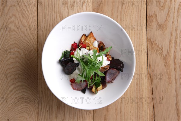 Top view of hot salad with deep fried beetroot