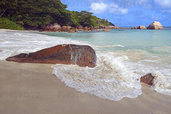 Beach and rocks of Anse Lazio in the evening