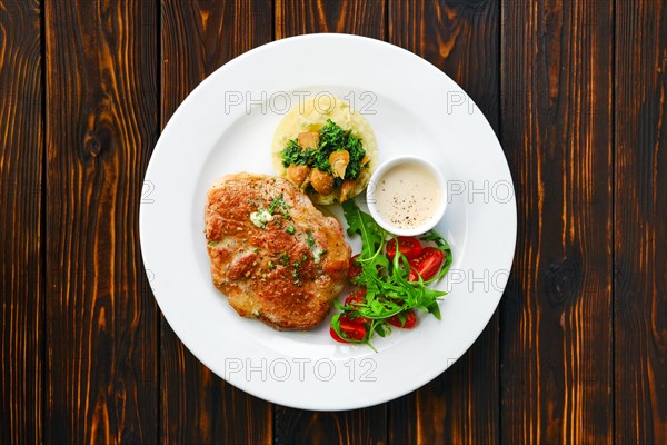 Top view of fried chop pork cutlet with mashed potato and