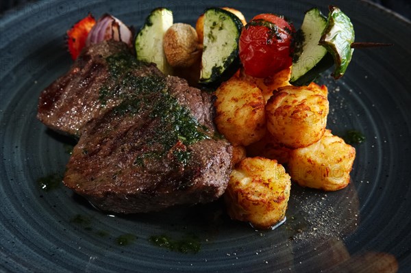 Juicy grilled beef fillet with potato