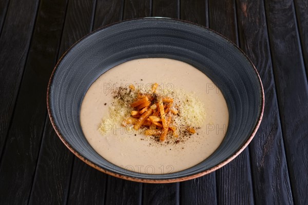 Mushroom soup puree with bacon flakes