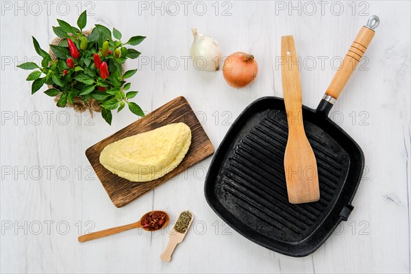 Top view of homemade cheese for frying on grill pan