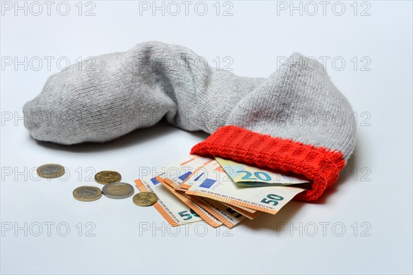 Banknotes in woollen sock