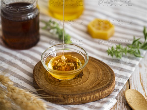 Delicious honey pouring bowl