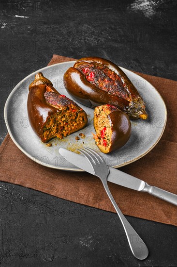 Aubergine filled with meat baked in oven