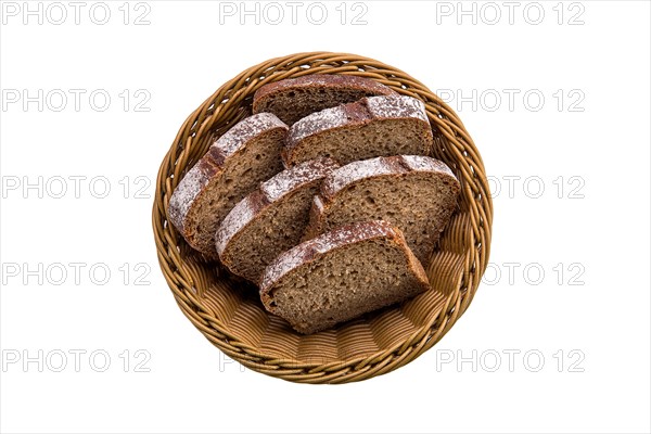 Top view of brown bread in basket isolated on white