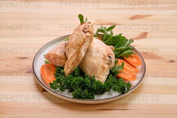 Fried chicken fillet on wooden table