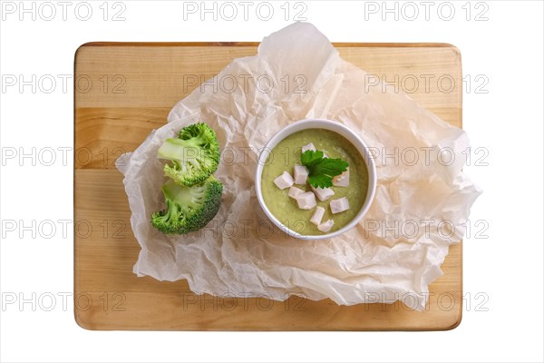Soup puree with broccoli in cardboard cup