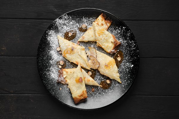 Top view of thin pancakes stuffed with pear