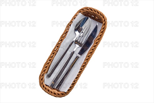 Set of cutlery in basket isolated on white background