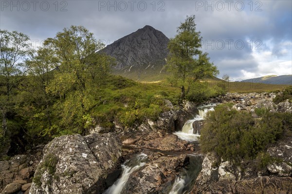 Waterfalls in front of mountain range Buachaille Etive Mor