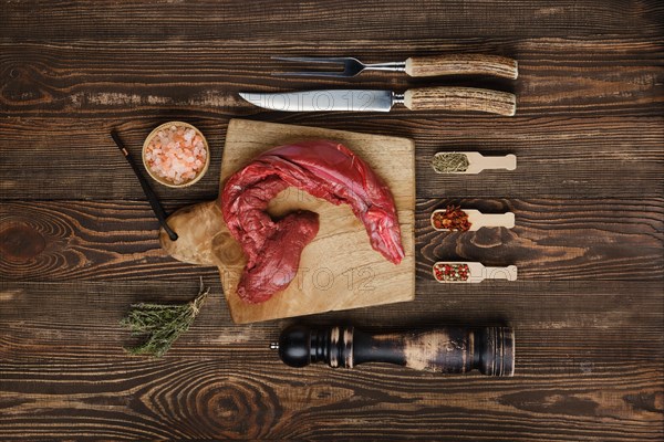 Overhead view of raw fresh top round beef strip with spices