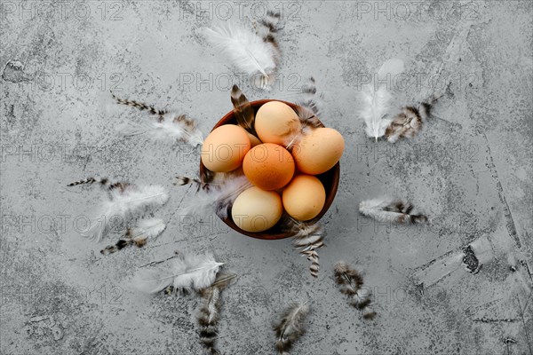 Fresh country eggs in clay bowl