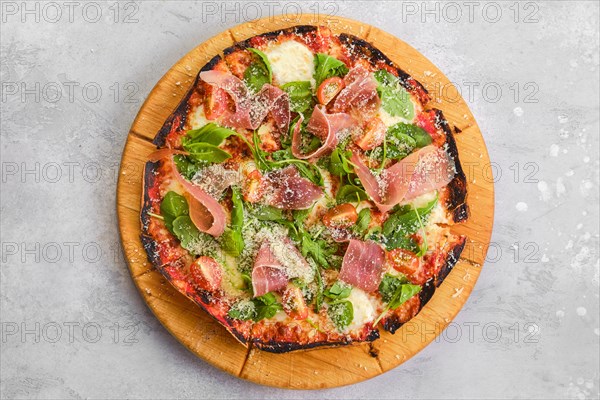 Thin-crust pizza dough with prosciutto ham