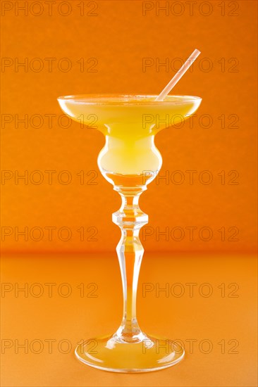 Old Cuban cocktail on orange background