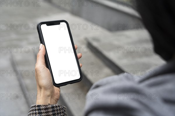 Close up hand holding phone