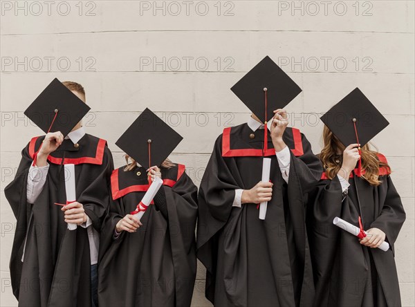 Front view students covering faces