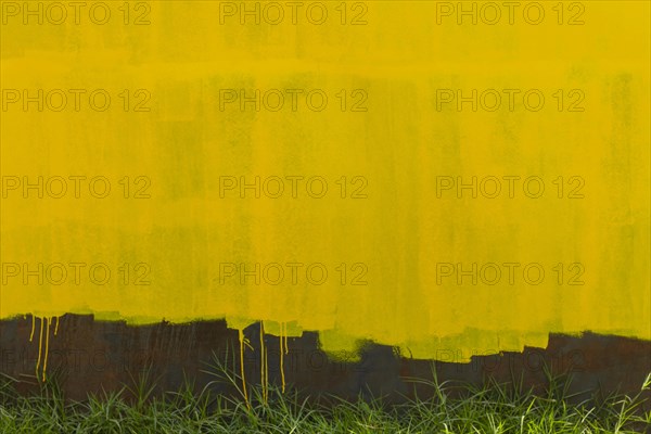 Rusty metallic wall background yellow old paint