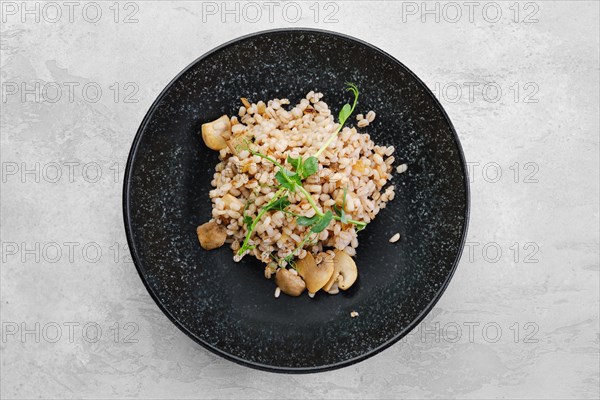 Boilet pearl barley with fried mushrooms