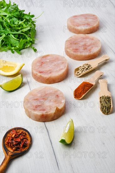 Frozen round fish cutlet with spice