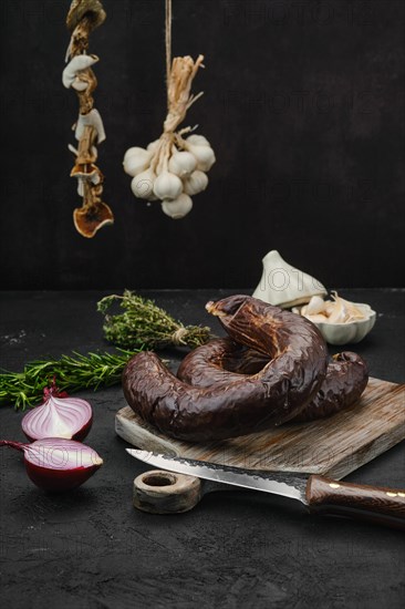 Organic blood pudding on cutting board