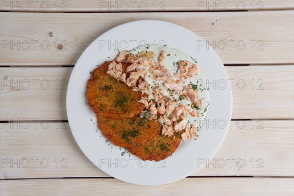 Potato pancakes with chopped salmon. Top view