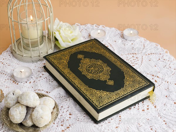 Close up quran table with pastries