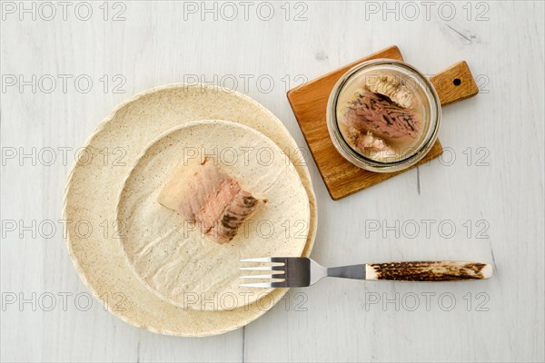 Top view of canned sturgeon on a plate