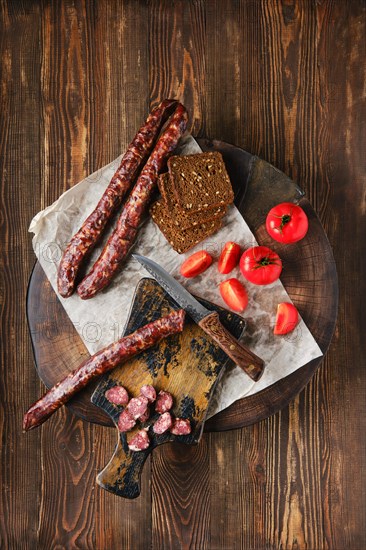 Overhead view of dried sausage made of venison spicy meat and lard