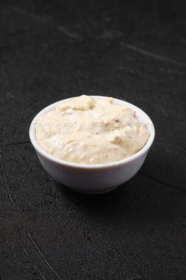 Small bowl with caesar sauce for salad