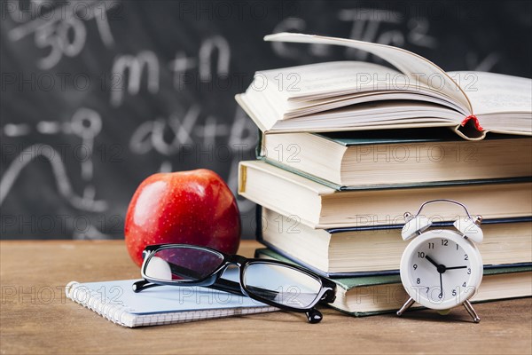 Clock ahead textbooks teacher desk