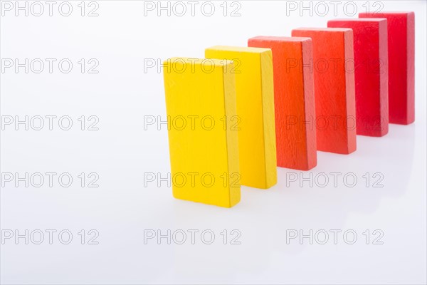 Colorful Domino Blocks in a line on a white background