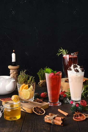 Composition with herbal and fruit tea with ingredients on the table