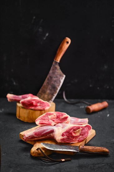 Fresh raw lamb ram shank in the process of cutting