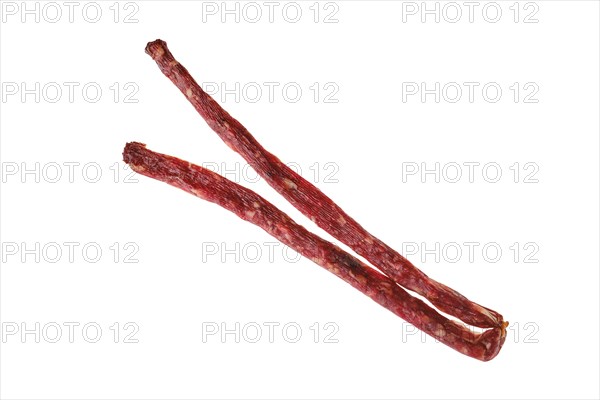 Overhead view of air dried deer and pork sausage isolated on white background