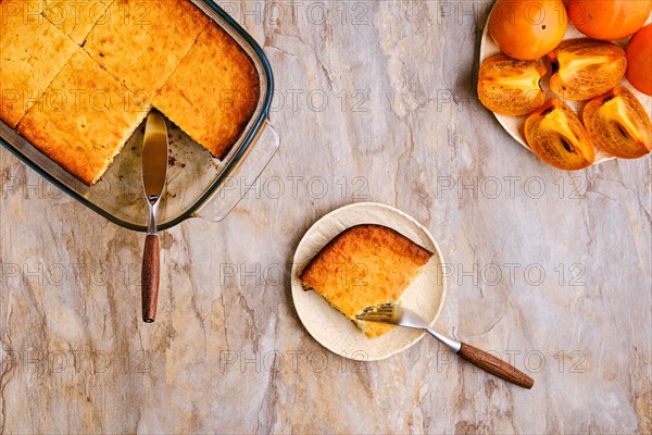 Persimmon pie on wooden table