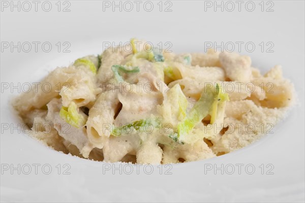 Delicious spaghetti bolognese garnished with parmesan cheese and basil. Selective focus photo